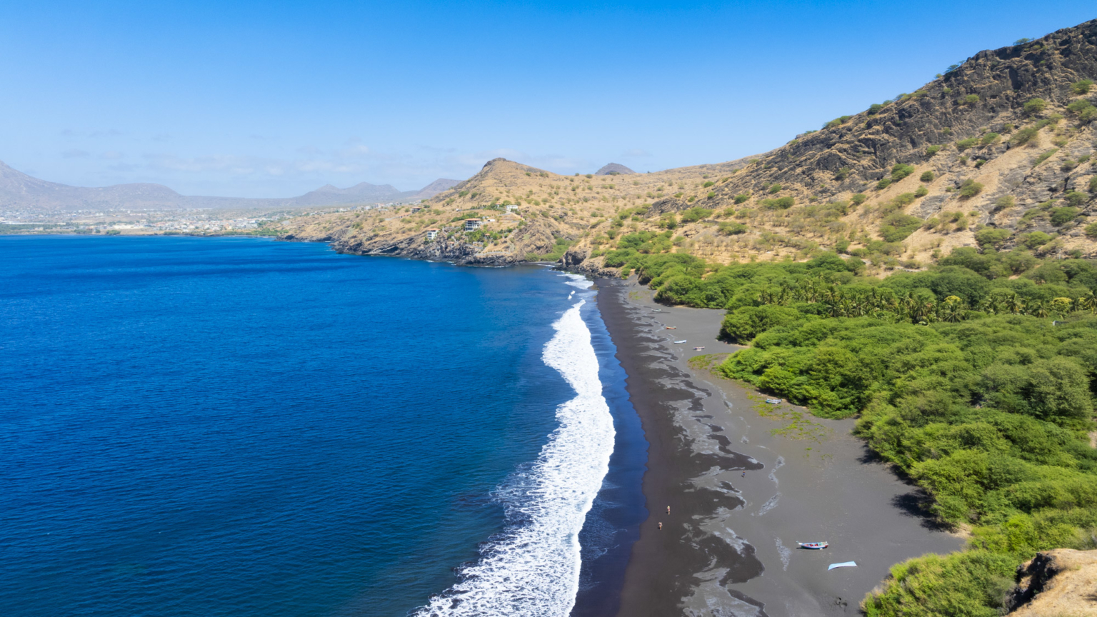 Ribeira da Prata Beach on Santiago Island, Cape Verde, known for its unique black volcanic sand and peaceful turquoise waters